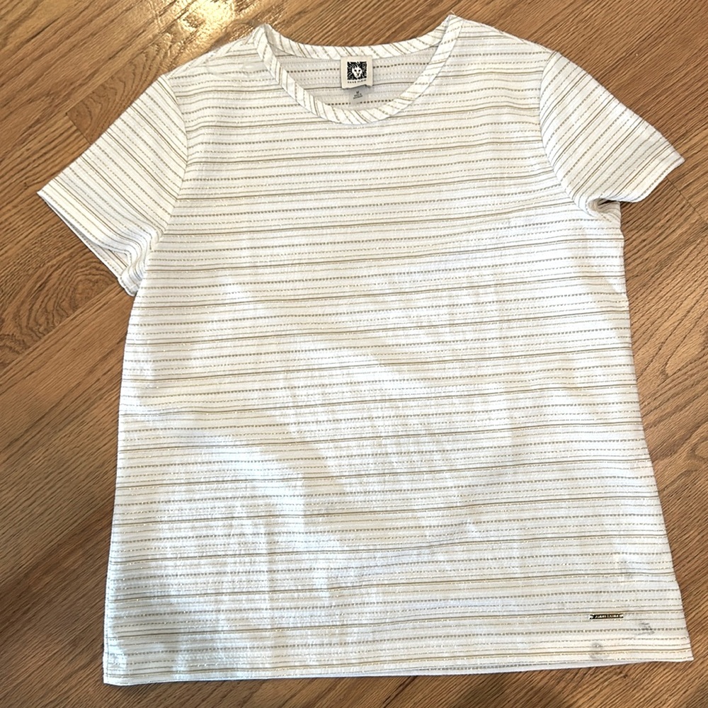 White top with gold accents